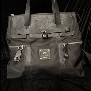 Henri Bendel jetsetter Black backpack purse includes dust cover